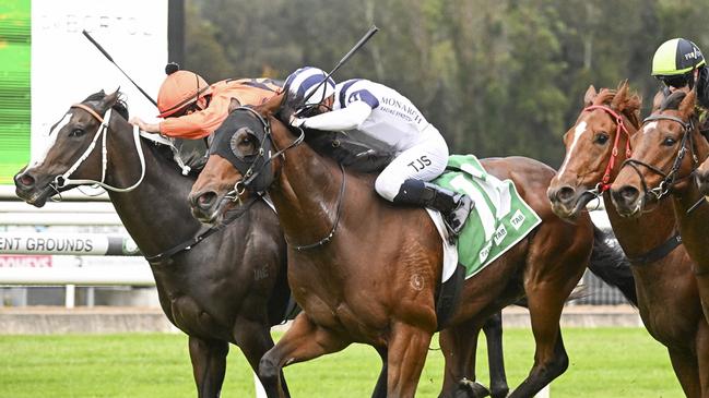 Barber (white) beats Brudenell to win the listed Takeover Target Stakes. Picture: Bradley Photos