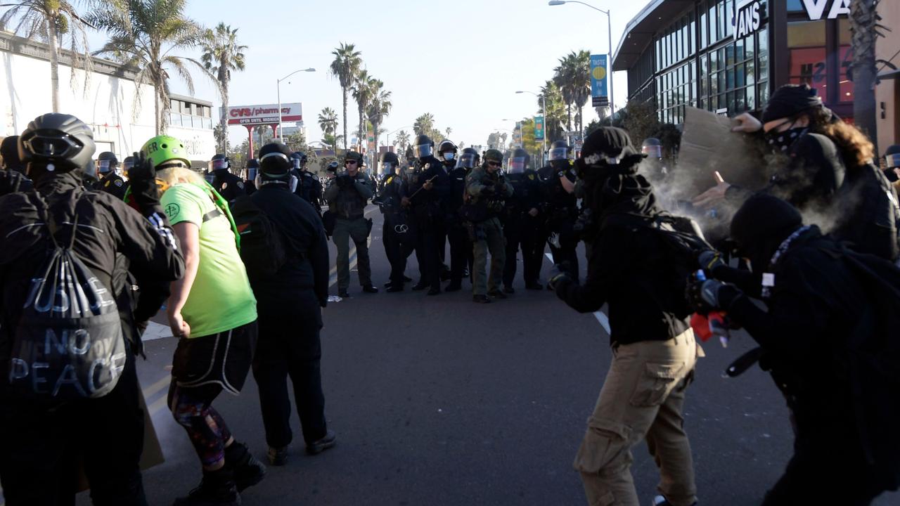 Police officers fired pepper balls at counter-protesters. Picture: Patrick T. Fallon/AFP