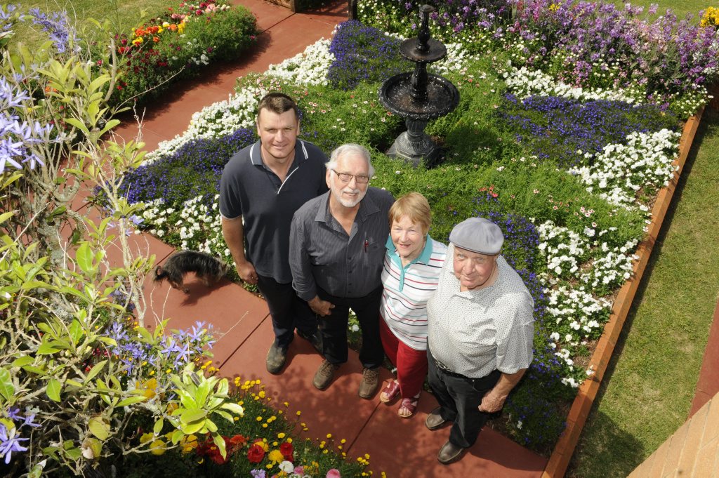 Chronicle Garden Competition city garden judge Lawrie Smith (second from left) chats with entrants in Primrose St Peter Kotzur (left) and Del and Alf Wagland. Picture: Bev Lacey