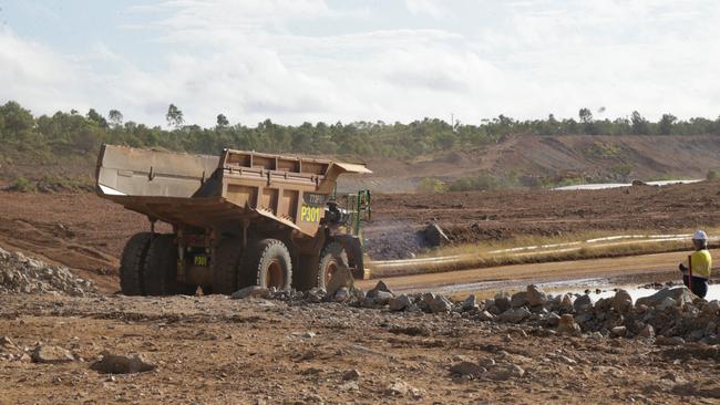 Earth moving machines begin construction of the upper dam wall that will gravity feed water into a lower dam to create power at the Kidston pumped hydro project. Picture: Peter Carruthers