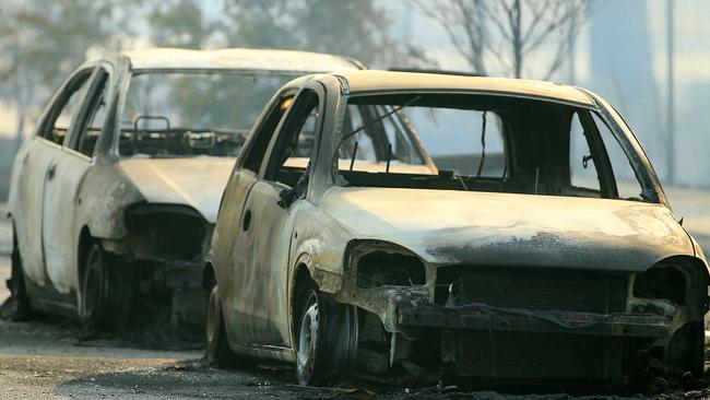 Burnt out cars near the scene of the gas explosions.