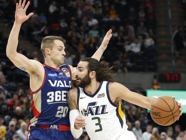 Adelaide 36ers guard Nathan Sobey (L) defends Utah's Ricky Rubio. Picture: AP