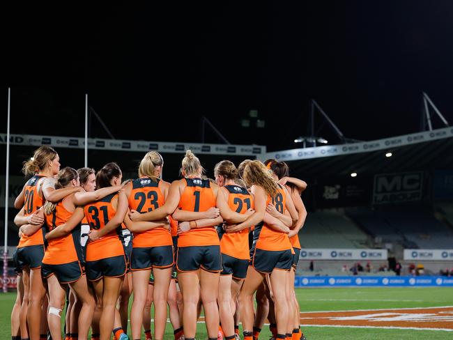 MELBOURNE, AUSTRALIA - OCTOBER 03: The GWS Giants huddle after a loss during the 2024 AFLW Round 06 match between the Melbourne Demons and the GWS GIANTS at IKON Park on October 03, 2024 in Melbourne, Australia. (Photo by Dylan Burns/AFL Photos via Getty Images)