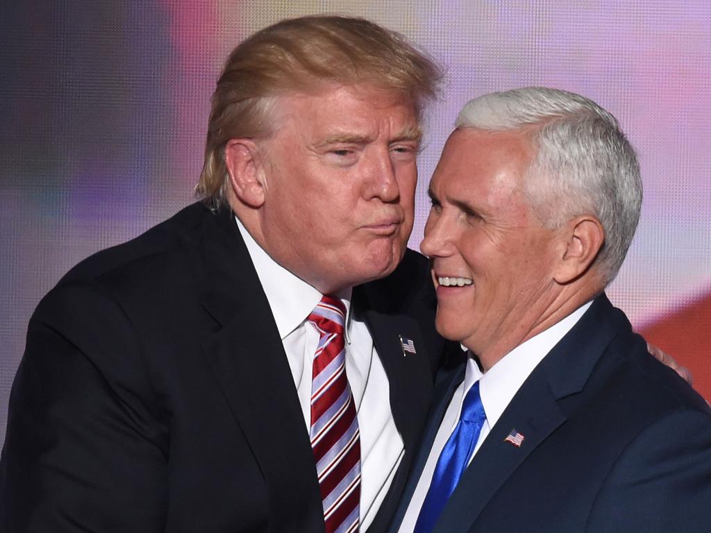 US Republican presidential candidate Donald Trump greets vice presidential candidate Mike Pence after his speech on day three of the Republican National Convention at the Quicken Loans Arena in Cleveland, Ohio, on July 20, 2016. / AFP PHOTO / TIMOTHY A. CLARY