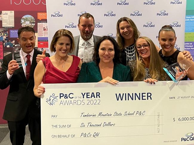 Members of the Tamborine Mountain State School P&amp;C celebrate after being named best in Queensland.