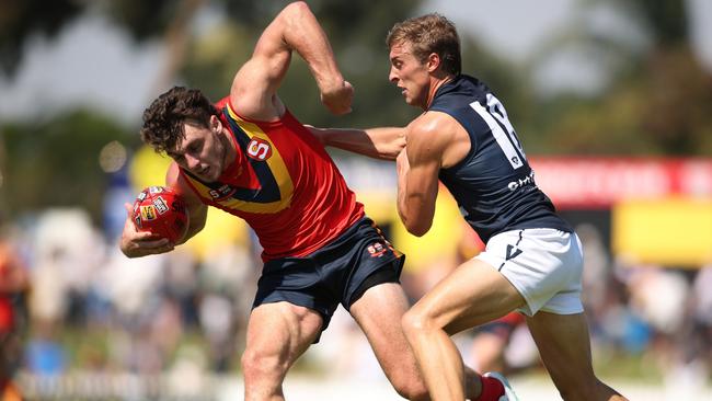 ADELAIDE, AUSTRALIA - APRIL 06: Jackson Callow of South Australia shrugs off Roarke Smith of Victoria during the 2024 AAMI State Game between SANFL West End State Team and Smithy's VFL State Team at Glenelg Oval, on April 06, 2024, in Adelaide, Australia. (Photo by Maya Thompson/AFL Photos/via Getty Images)