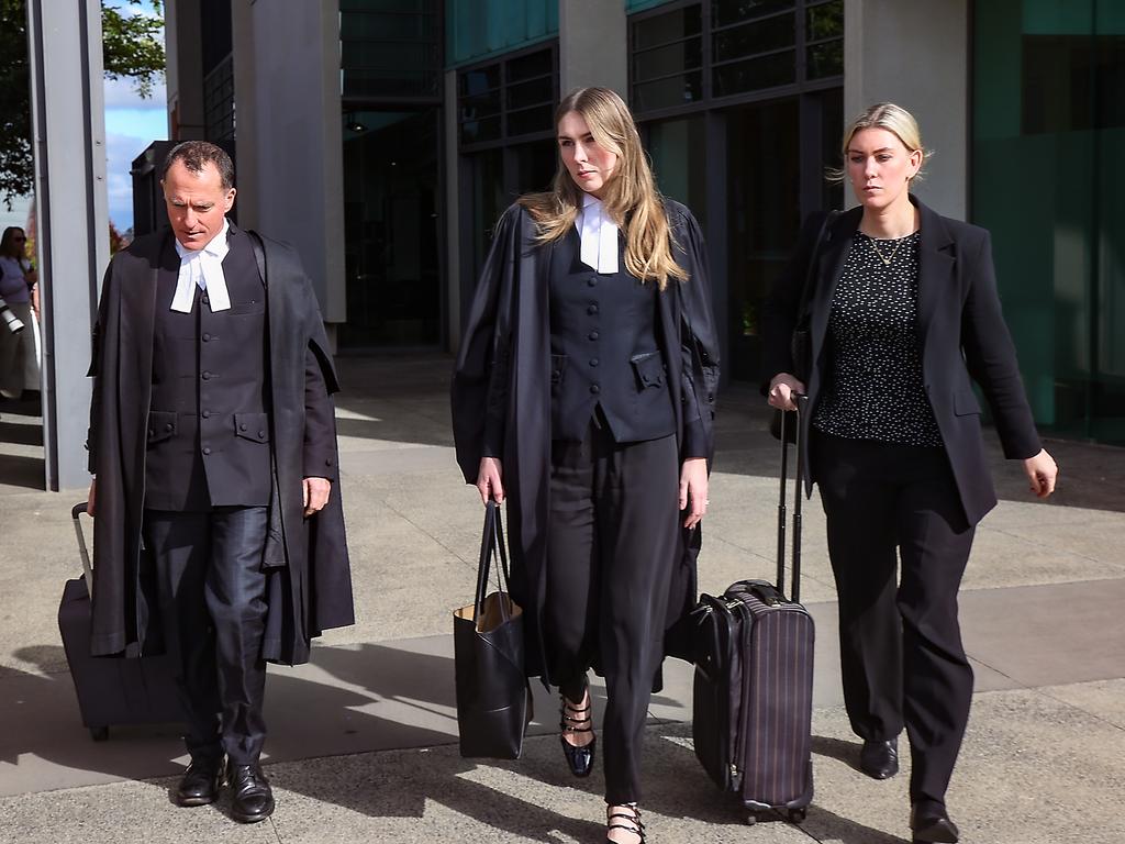 Defence Barrister Colin Mandy and his team leave court. Picture: NewsWire/Ian Currie