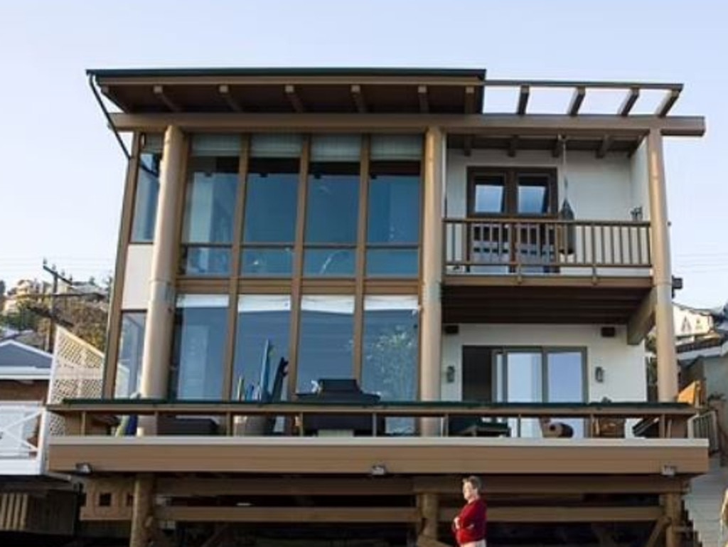 Ryan O'Nea outside his Malibu home in 2004. The beachfront home has been destroyed. Picture: Supplied