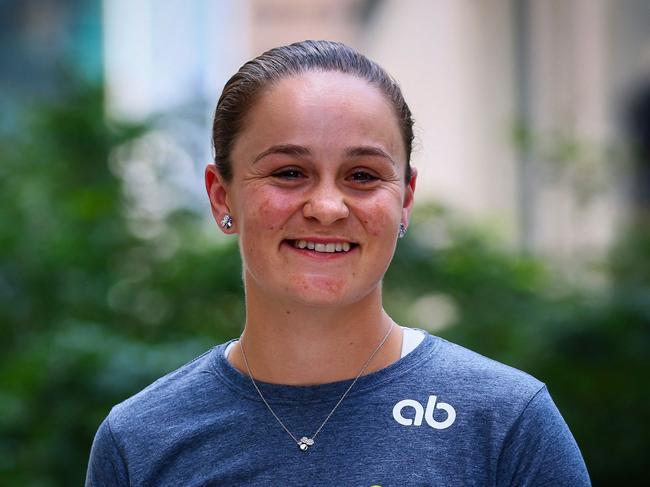 Australia's Ashleigh Barty smiles during a press conference in Brisbane on March 24, 2022, after she announced her retirement from tennis. (Photo by Patrick HAMILTON / AFP) / IMAGE RESTRICTED TO EDITORIAL USE - STRICTLY NO COMMERCIAL USE