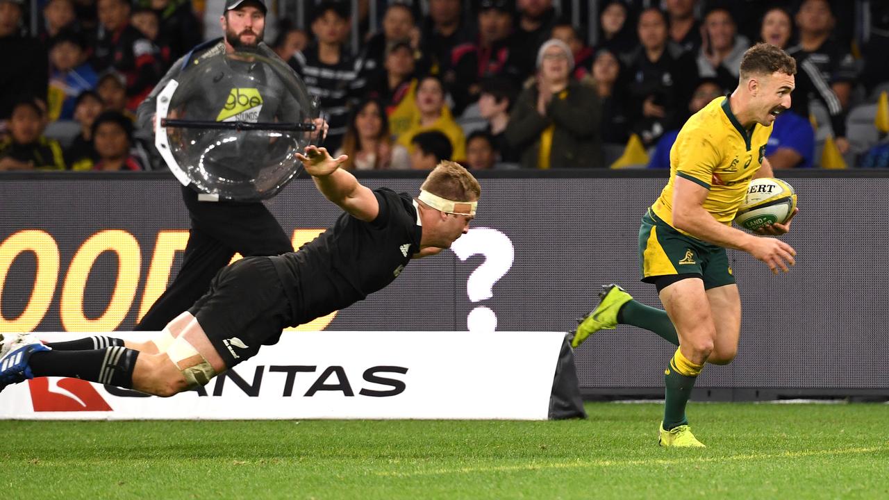 Nic White of the Wallabies gets clear to score a try during the Bledisloe Cup match.