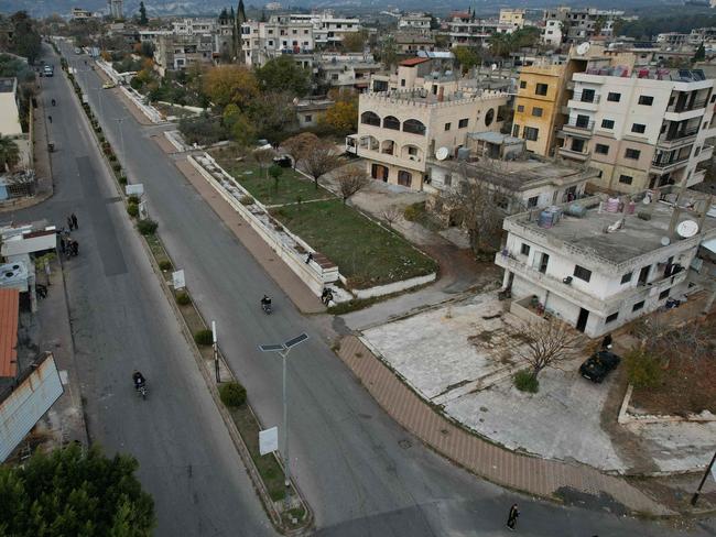 An aerial picture shows a view of Qardaha, the al-Assad family's ancestral village, in Syria's western Latakia province on December 11, 2024. Islamist-led rebels took Damascus in a lightning offensive on December 8, ousting president Bashar al-Assad and ending five decades of Baath rule in Syria. (Photo by Aaref WATAD / AFP)