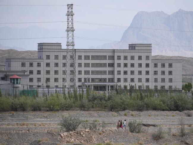 (FILES) This file photo taken on June 2, 2019 shows a facility believed to be a re-education camp where mostly Muslim ethnic minorities are detained, in Artux, north of Kashgar in China's western Xinjiang region. - Canada on January 12, 2021 announced a ban on the import of goods suspected of being made using forced labor in China's restive Xinjiang region, following a similar move by Britain. In a statement, the foreign ministry said it was "gravely concerned with evidence and reports of human rights violations" against Xinjiang's Muslim Uighurs and other ethnic minorities in the autonomous northwestern region. (Photo by GREG BAKER / AFP)