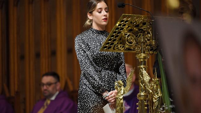 Amber Fahey delivers a reading at her grandfather's funeral. Picture: Nick Moir