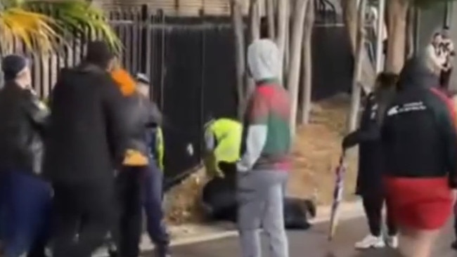 A man was tackled and arrested outside the stadium. Photo: Channel 9.