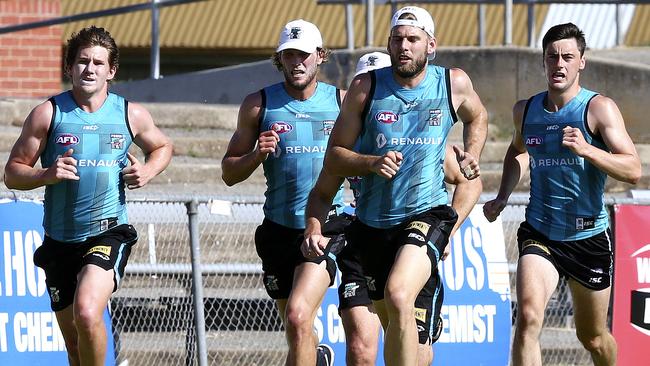 Matt White (left), at Port Adelaide training at Alberton Oval.