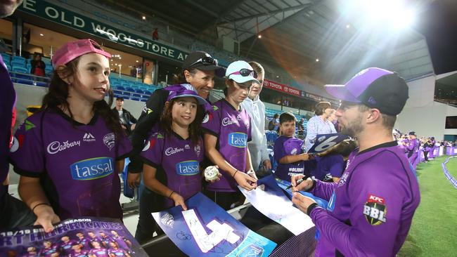 Fan favourite Wade signs autographs for supporters in the crowd during the Hurricanes v Renegades Big Bash League Match at Blundstone Arena on Thursday. Picture: SCOTT BARBOUR/GETTY IMAGES