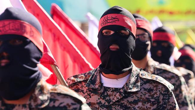 Iranians attend the funeral procession for the IRCG members killed in the Damascus strike. Picture: AFP.