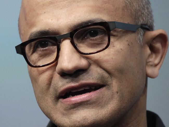 FILE- In this May 20, 2014 file photo, Satya Nadella, CEO of Microsoft, talks during the introduction the Surface Pro 3 tablet device at a media preview in New York. Microsoft on Thursday, July 17, 2014 announced it will lay off 18,000 workers over the next year. (AP Photo/Mark Lennihan, File)