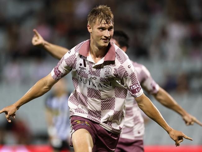 Thomas Waddingham of the Brisbane Roar celebrates scoring a goal. Picture: Cameron Spencer/Getty Images