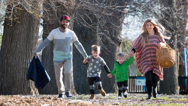 Bacchus Marsh’s Travis and Lana Arandt with their boys, Cooper and Oscar, enjoy some picnic time in Maddingley Park. Picture: Jay Town