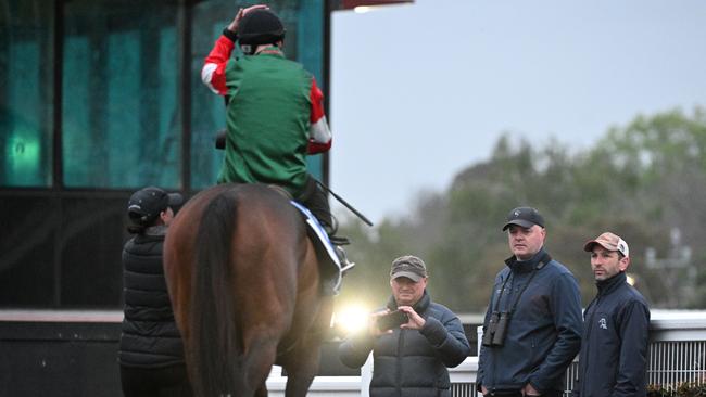 Simon Miller (second from right) supervises Amelia’s Jewel at trackwork in Melbourne in October last year. Picture: Vince Caligiuri / Getty Images