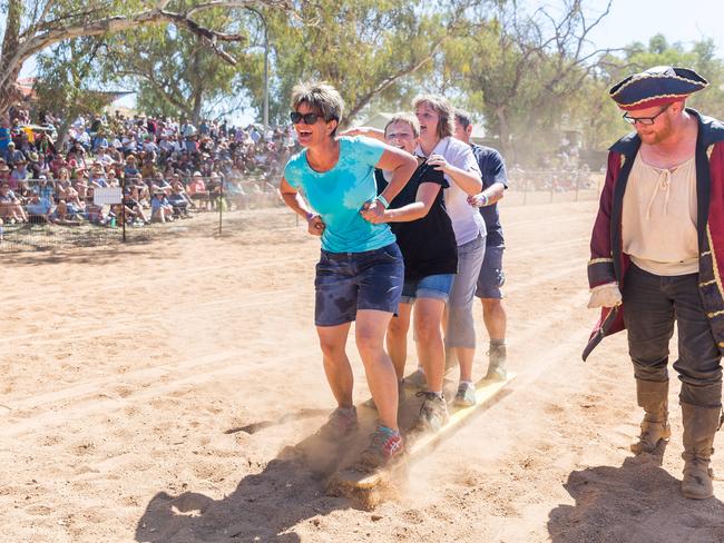 A team in the sand skis event gets advice from a pirate on how to walk on planks at the Henley on Todd Regatta. Alice Springs August 19 2017. Photo: EMMA MURRAY