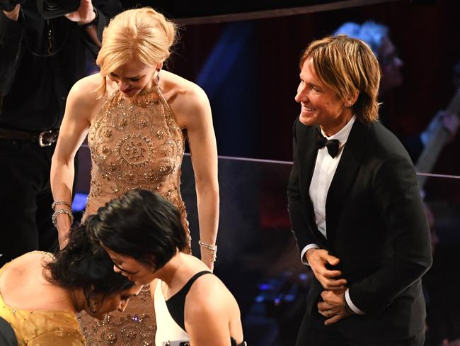 Nicole Kidman and husband Keith Urban take their seats at the Oscars. Picture: Getty Images