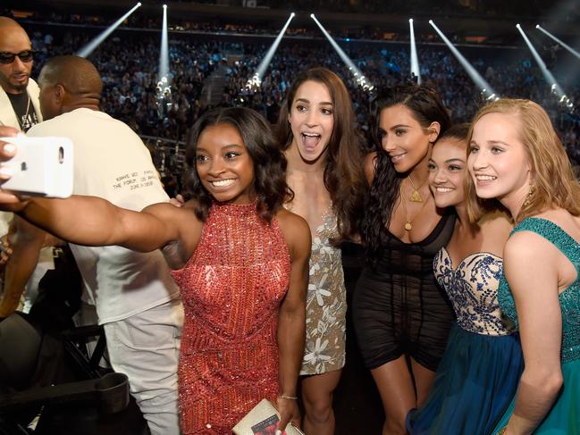 Olympic athletes Simone Biles, Aly Raisman, Laurie Hernandez and Madison Kocian pose with Kim Kardashian West at the 2016 MTV Video Music Awards at Madison Square Garden on August 28, 2016 in New York City. Picture: Getty