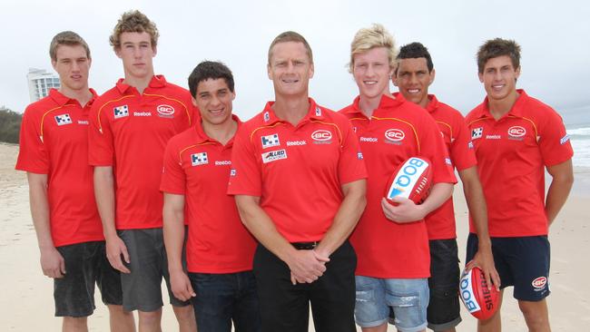 Gold Coast’s 2010 draft first-round picks; Sam Day, Tom Lynch, Dion Prestia, Josh Caddy, Harley Bennell and David Swallow with coach Guy McKenna.