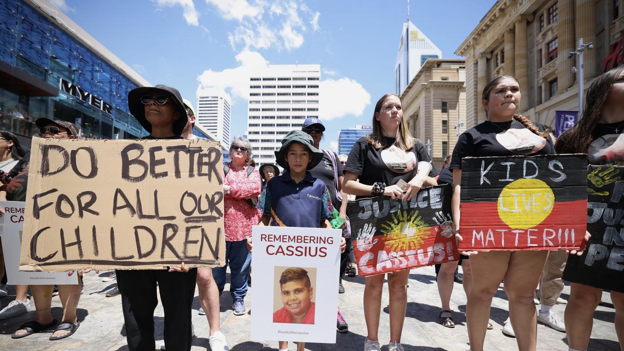 Members of the community hold signs during a rally for Cassius Turvey in Perth. Picture: Matt Jelonek/Getty Images