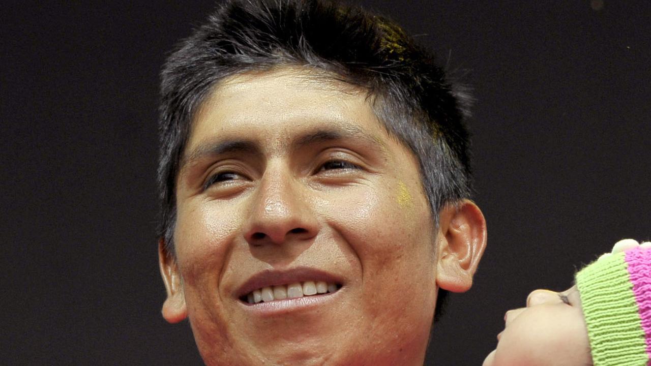 Colombia's Nairo Quintana holds her daughter Mariana as he stands on the podium after winning the Giro D'italia, Tour of Italy cycling race, in Trieste, Italy, Sunday, June 1, 2014. Nairo Quintana confirmed himself as cycling's next star by winning the Giro d'Italia on Sunday to follow his runner-up finish in last year's Tour de France. The 24-year-old climbing specialist with the Movistar team won two stages and finished with a 3 minute, 7 second advantage over fellow Colombian Rigoberto Uran for his first Grand Tour victory. Italy's Fabio Aru finished third overall, 4:04 back. (AP Photo/MArco Alpozzi)