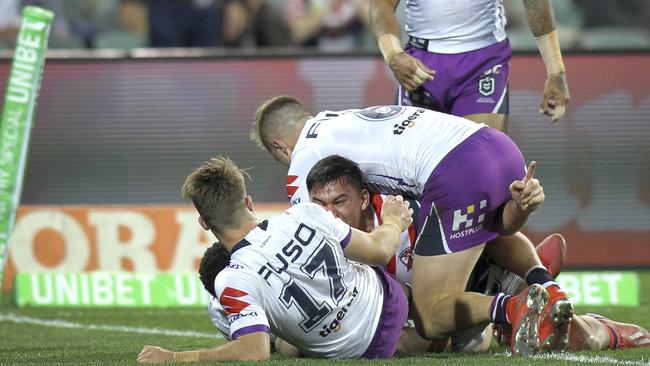 Rooster's Joseph Manu crashes over for a try against the Storm at Adelaide Oval. Picture: Dean Martin