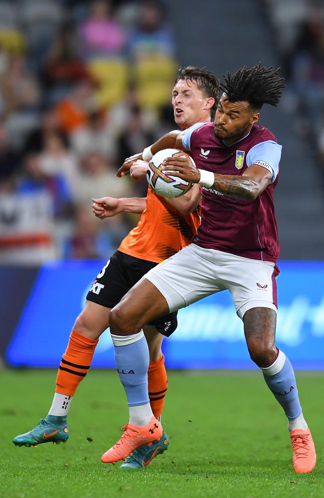 Joe Knowles of the Roar and Tyrone Mings of Aston Villa compete for the ball during the 2022 Queensland Champions Cup match between Aston Villa and Brisbane Roar at Queensland Country Bank Stadium on July 20, 2022 in Townsville. (Photo by Albert Perez/Getty Images)