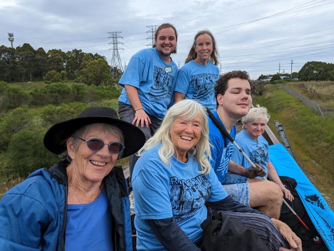 Protesters linked to the Newcastle-based activist group Rising Tide entered the rail corridor at Sandgate and climbed on top of a train loaded with coal, where they remained for three hours.