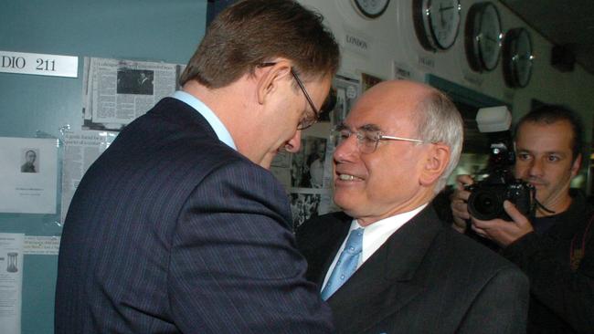 Then Labor leader Mark Latham shaking hands with then-prime minister John Howard at ABC Radio studios in Sydney on October 8, 2004, during the federal election campaign. Picture: John Feder