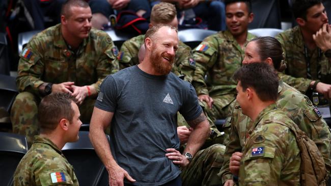 Australian Victoria Cross recipient Mark Donaldson (centre) talks to soldiers during the Invictus Games in Sydney this week. Picture: Cameron Spencer/Getty