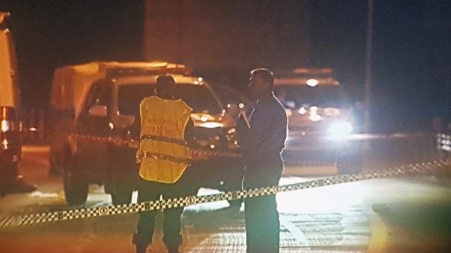 Police at the scene on the Pacific Highway after the shooting. Picture: Frank Redwood