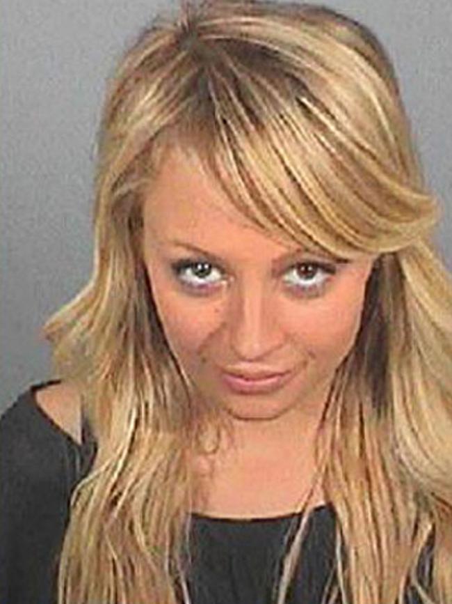 Reality TV star <b>Nicole Richie</b> served just 82 minutes of a four-day sentence for driving under the influence of drugs in August 2007, and by the time she’d posed for this booking photo and had fingerprints taken, she never saw a cell. The quick release from LA County Jail was in line with policies to prevent prison overcrowding. “She was really treated like any other inmate,” said her lawyer, Shawn Chapman Holley. Picture: AP