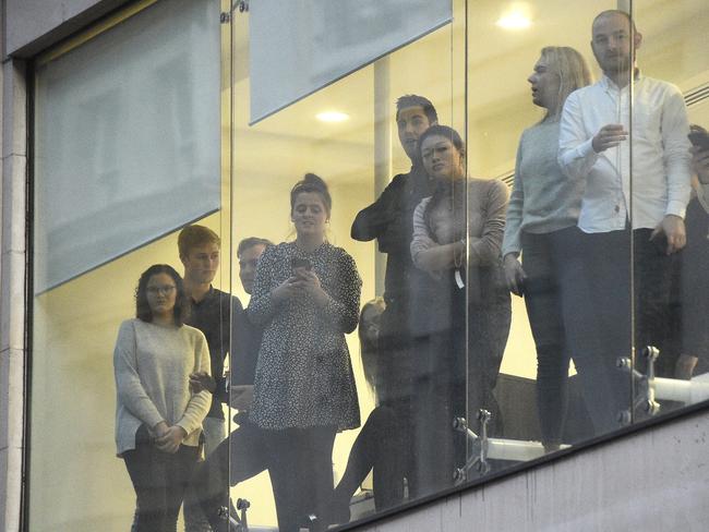 Office workers watching police near the scene of an incident on London Bridge. Picture: Kirsty O'Connor/PA