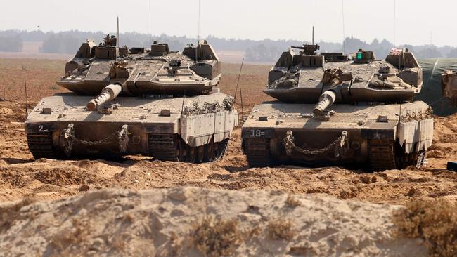 Israeli army tanks take position at the border between Israel and the Gaza Strip on May 22, 2025. Picture: AFP
