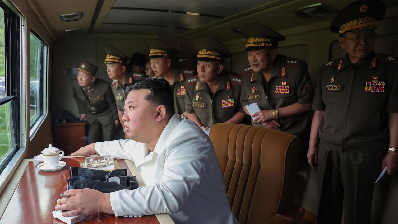 North Korea’s Kim Jong Un oversaw the test-firing of a new 240mm multiple rocket launcher with a guiding system. Picture: AFP