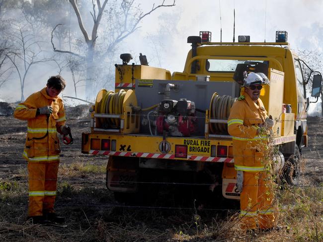 Scrub fire at Julago, just south of Townsville, causes delays to traffic on Bruce Highway. Rural Fire fighters from Nome. Picture: Evan Morgan