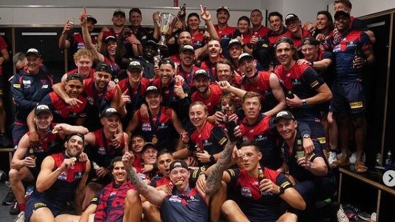 Melbourne players in the rooms after their epic grand final win.