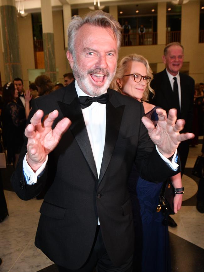 Actor Sam Neill and journalist Laura Tingle arrive for the annual Midwinter Ball at Parliament House in Canberra. Picture: AAP