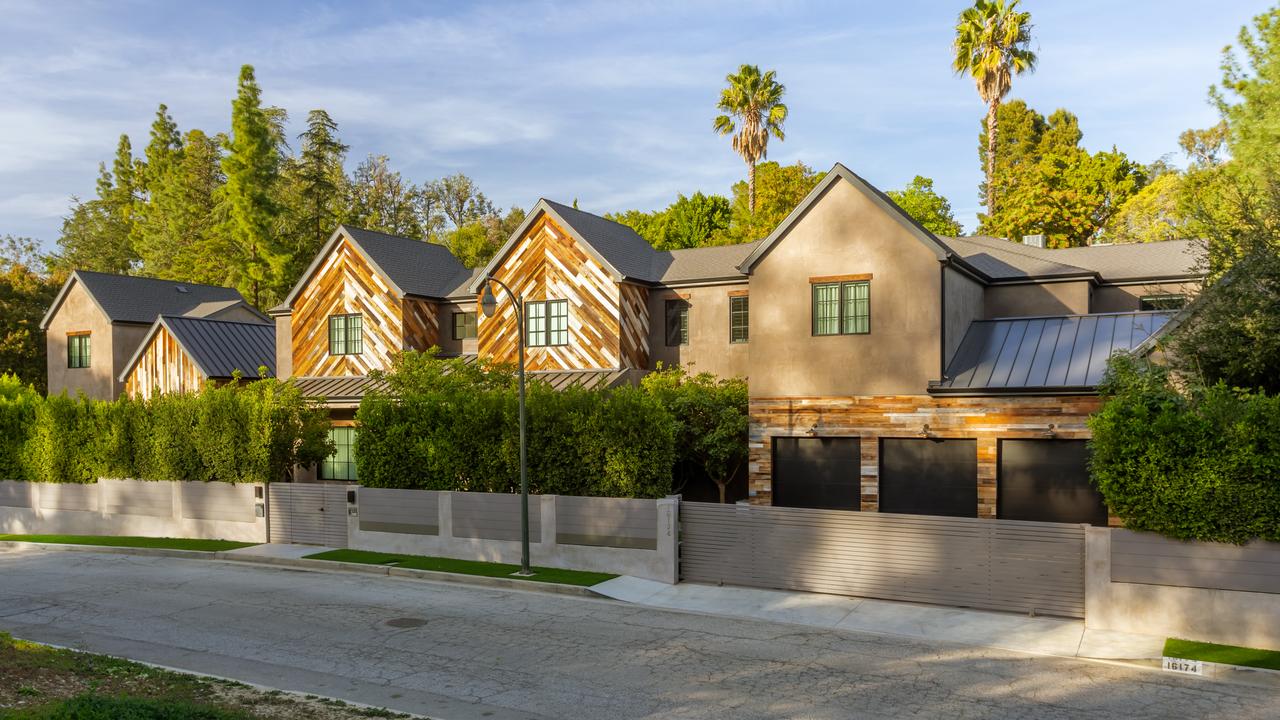 The unassuming front of the home looks like a modern farmhouse. Picture: Cameron Carothers for Compass