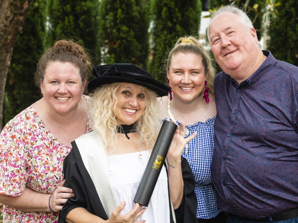 Doctor of Creative Arts graduate Terri Hethorn with family (from left) Sierra Herbert, Rhylea Millar and Joe Millar at the UniSQ graduation ceremony at Empire Theatres, Tuesday, December 13, 2022.