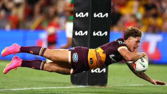 Reece Walsh dives across to score under the posts.