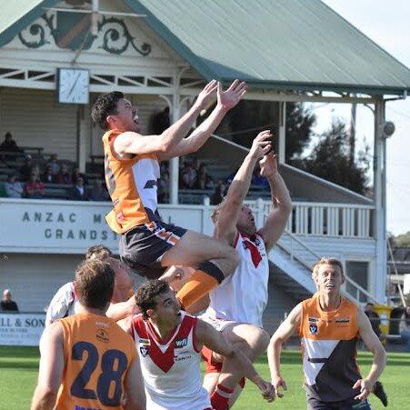 Southern Mallee Giants coach Kieran Delahunty soars over the pack in the Wimmera league second semi-final against Ararat. Picture: Georgia Hallam