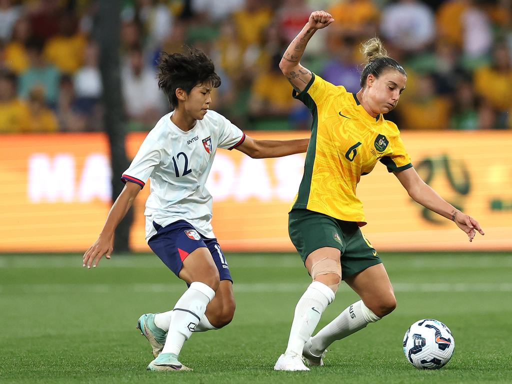 MELBOURNE, AUSTRALIA - DECEMBER 04: Chloe Logarzo of Australia is challenged by Pu Hsin-Hui of Chinese Taipei during the International Friendly match between Australia Matildas and Chinese Taipei at AAMI Park on December 04, 2024 in Melbourne, Australia. (Photo by Robert Cianflone/Getty Images)