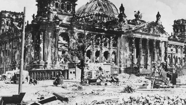 In this file picture from 1945, the wreckage of the Reichstag building is seen at the end of World War II (Two), in Berlin, Germany, with a destroyed German military vehicle in foreground. Picture: Ap